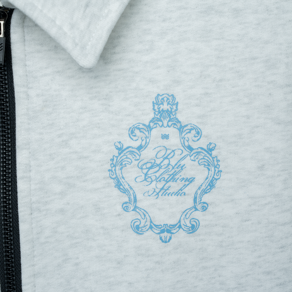 half-zip saaral logo detail.webp