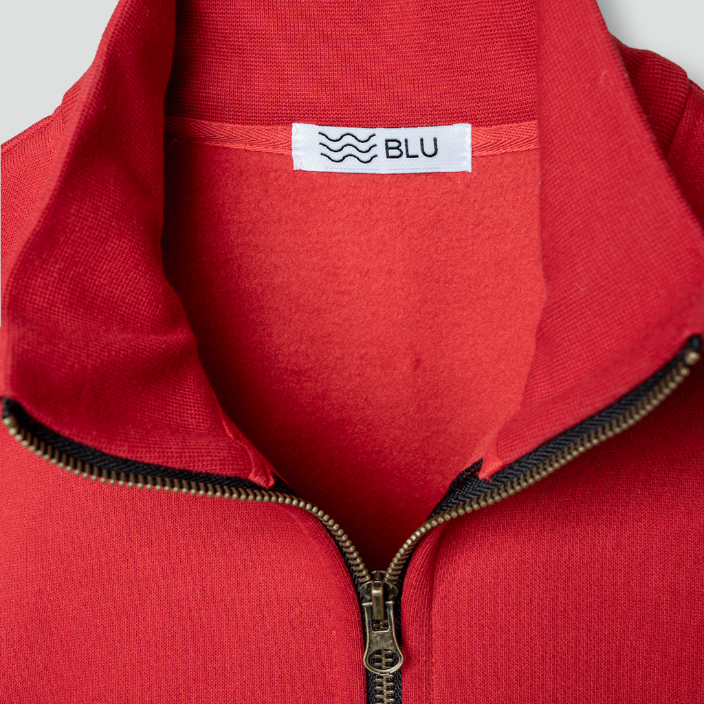red huwaalttai zip up enger detail.webp