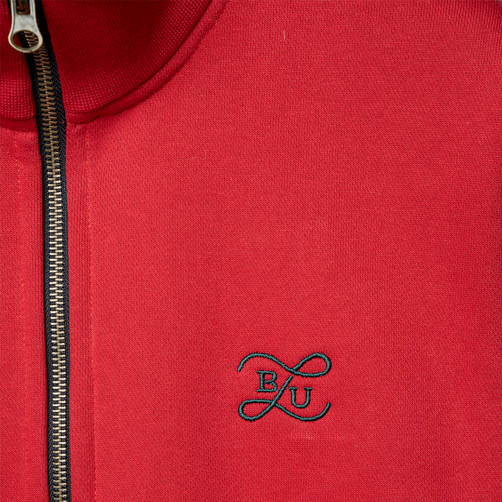 red huwaalttai zip up logo detail.webp